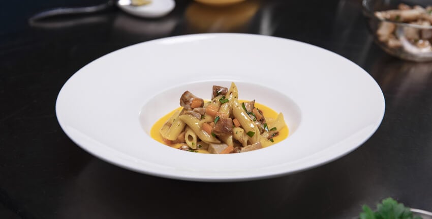 Plate of pumpkin cream with funghi porcini and balsamic vinegar